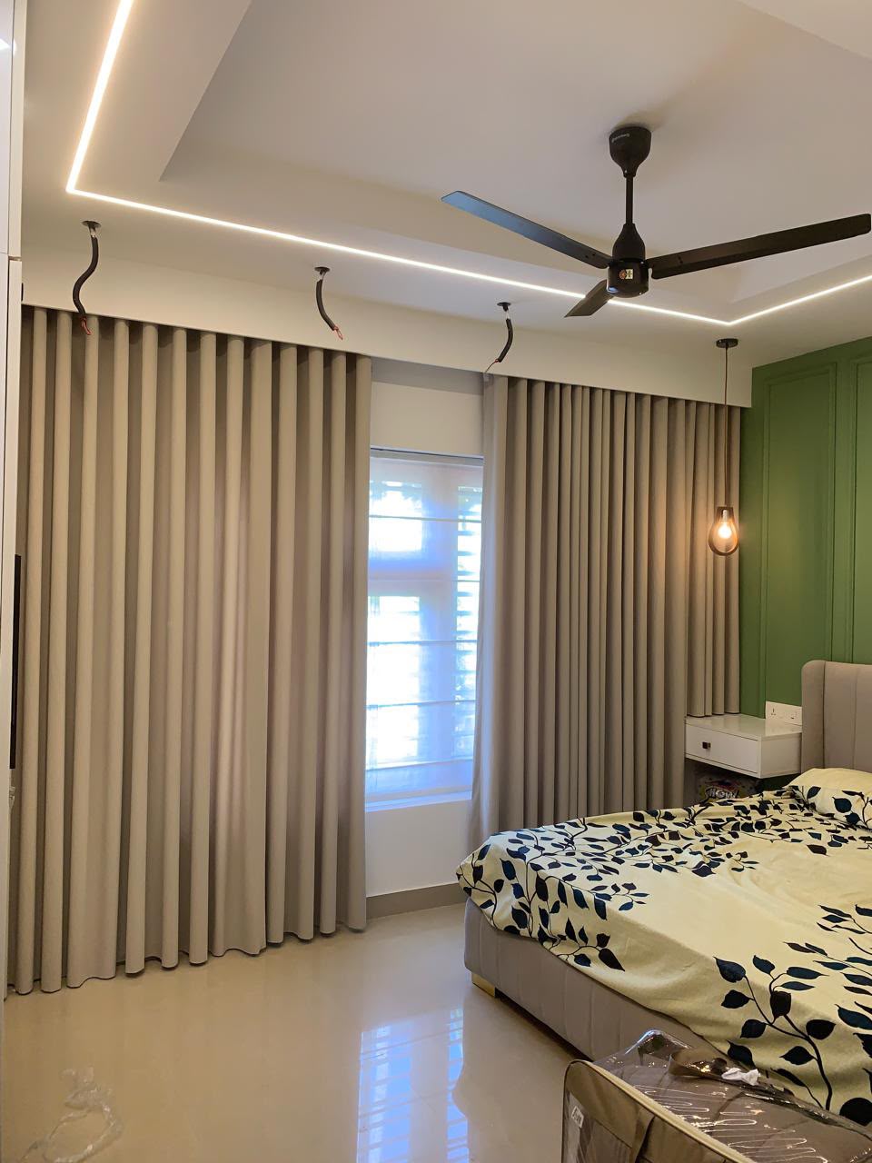 Room with ripple-fold curtains on a track
