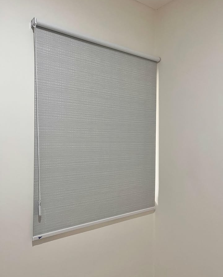 Detail of roller blind fabric and mechanism